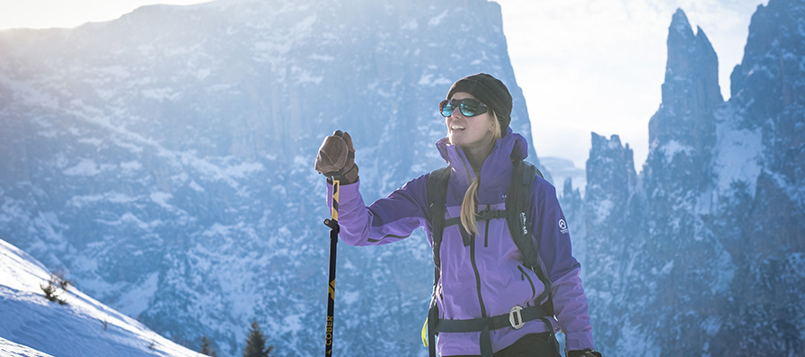 Backcountry skier wearing Smith Glacier Photochromic Venture sunglasses