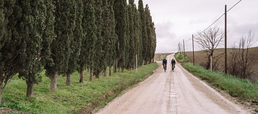 Gravel cyclists in the distance wearing Smith sunglasses and helmets