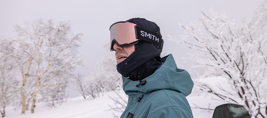 Snowboarder wearing Smith Squad cylindrical goggles