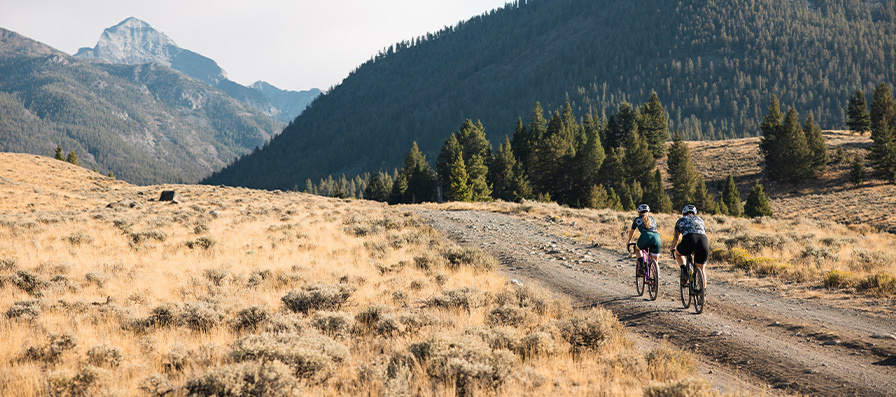 Gravel cyclists in the distance wearing Smith sunglasses and helmets