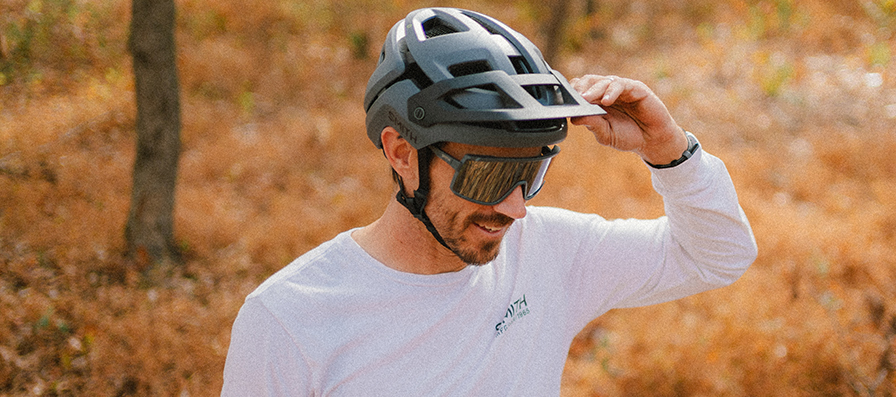 Mountain biker wearing Forefront 3 helmet & Pursuit sunglasses