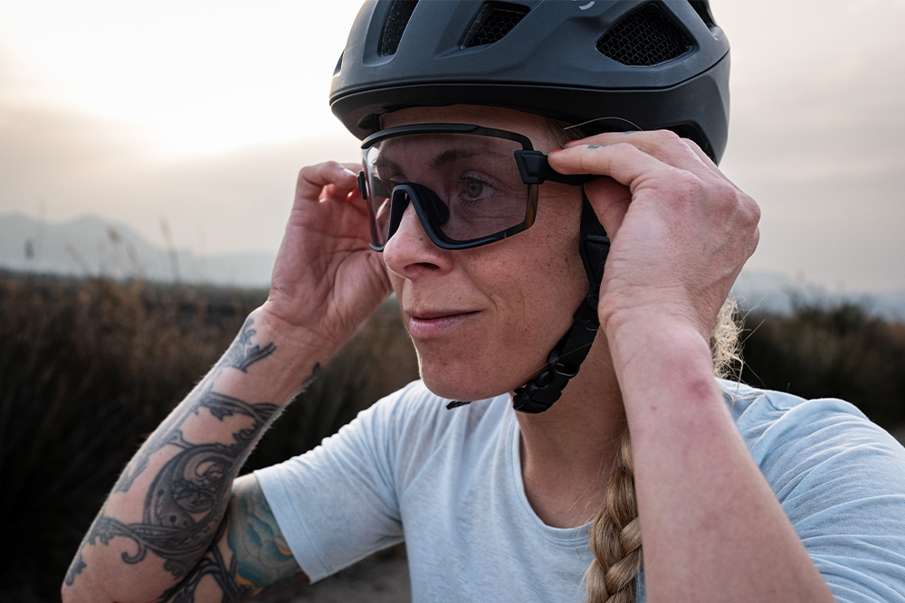 woman wearing smith network helmet and wildcat glasses