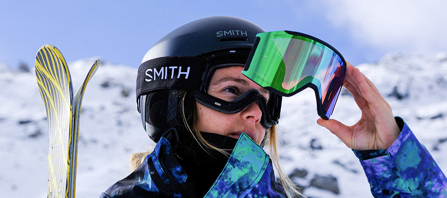 Skier changing Smith MAG goggle lens